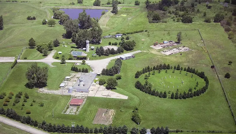 Aerial view of the Subterra Castle property outside Topeka, Kansas, showing the tower, buildings, pond and surrounding acreage