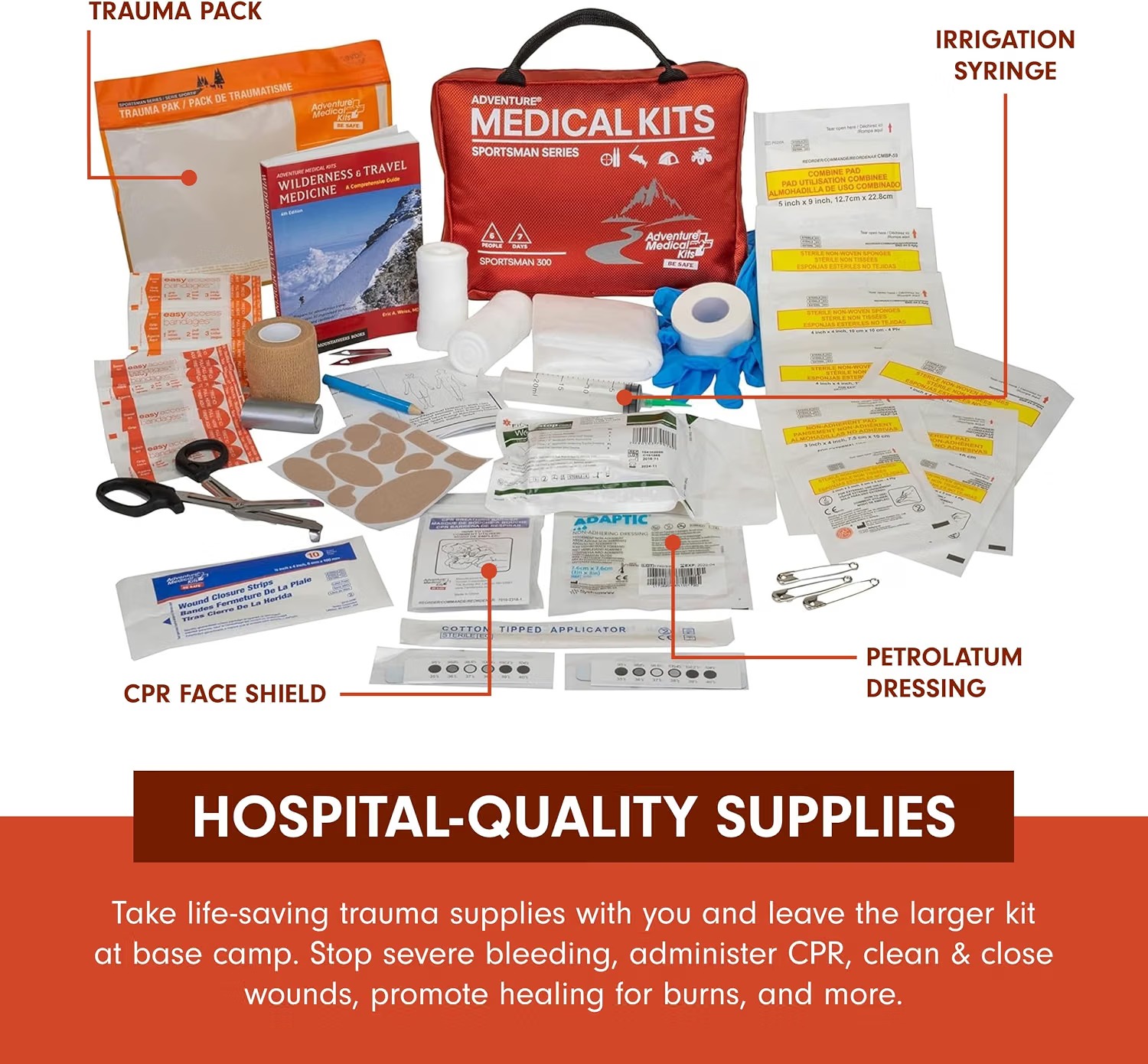 Full contents of the Adventure Medical Kits Sportsman 300 laid out, including dressings, medications, wound closure strips, tools and the Field Trauma Pak