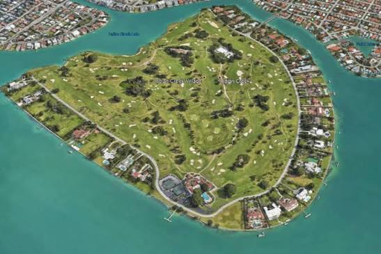 Aerial view of Indian Creek Island, a small private golf-course island ringed by water and a single perimeter road