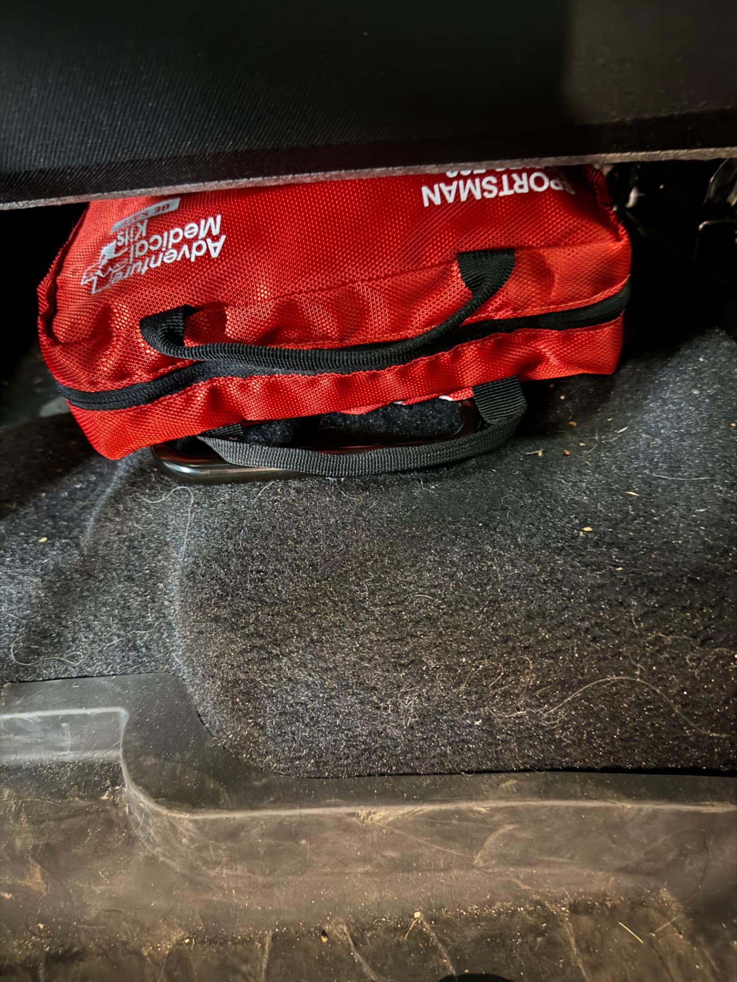 The Sportsman 300 tucked under a vehicle seat