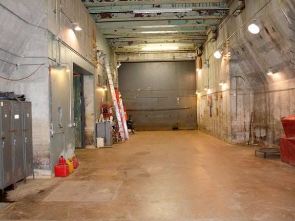 Former Atlas missile launch bay at Subterra Castle used as a cavernous concrete garage and workshop